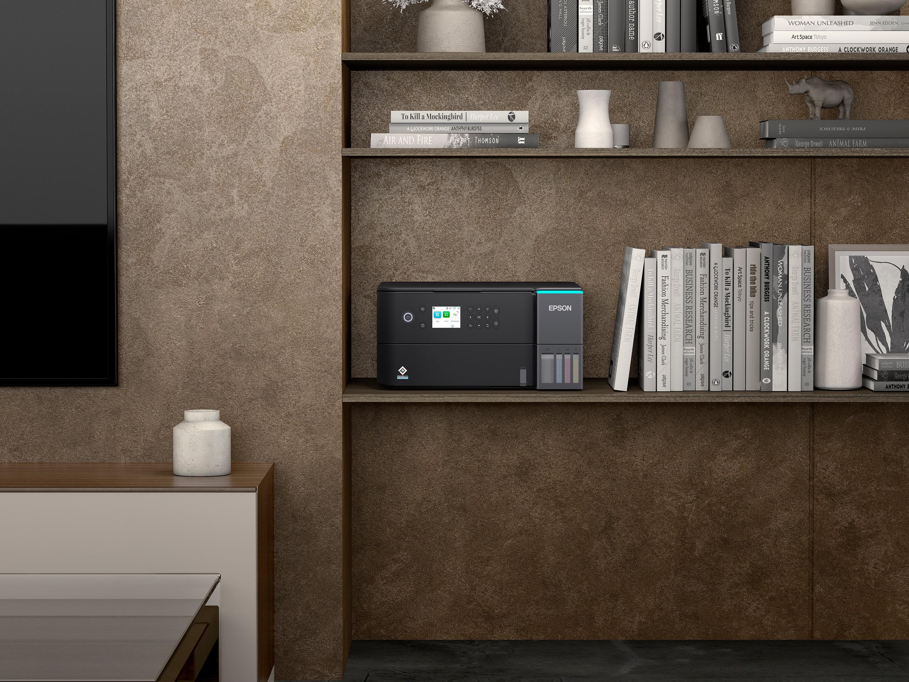 Epson EcoTank L6360 inkjet printer displayed on a modern shelf with books and decorative items.
